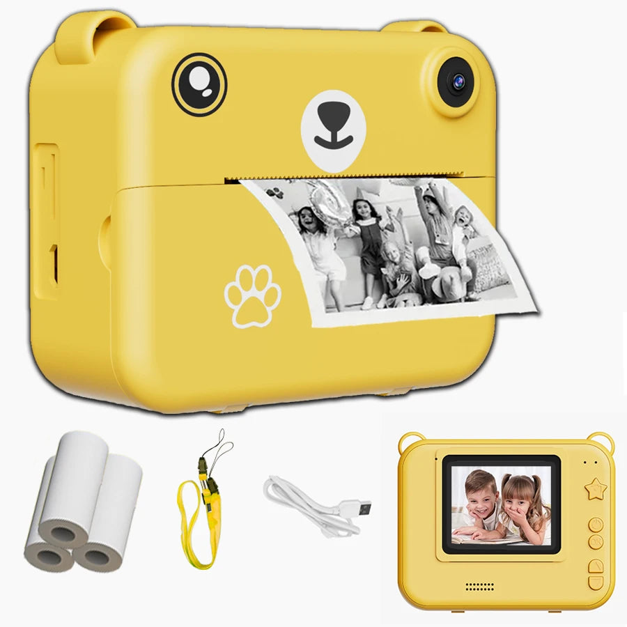 Kids instant print camera in yellow with thermal paper rolls, lanyard and USB cable